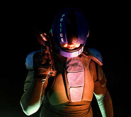 Cyberpunk concept, future world. Police officer cop in dark, halfman bionic cyborg or reloads gun, twitches cocking lever, Stands looks at camera in dark. Science fiction scene, fantasyの写真素材