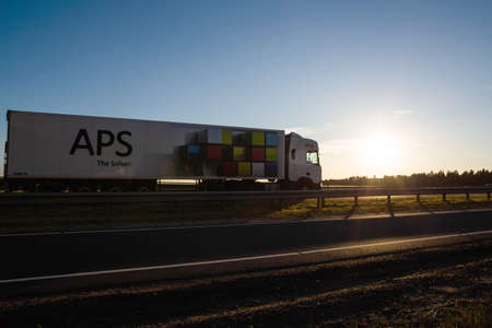 Road Bobruisk-Minsk, BELARUS 06/18/19: Truck driver drives a truck with a semitrailer against the...