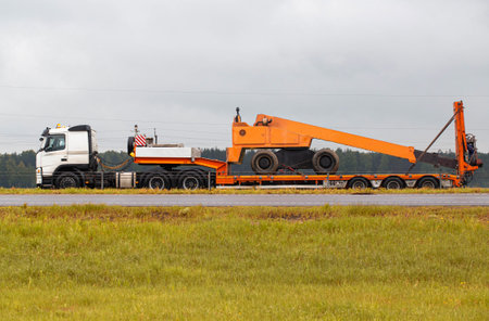 Transportation of oversized cargo by truck. Tower for carrying out repair work on a trailer....