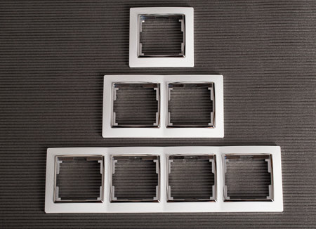 Modern frames for sockets on a gray background