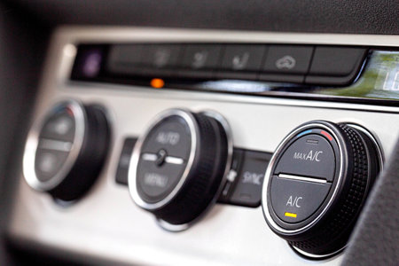 Modern car climate controls, macro. Modern climate control regulators in the car. beautiful interiorの写真素材