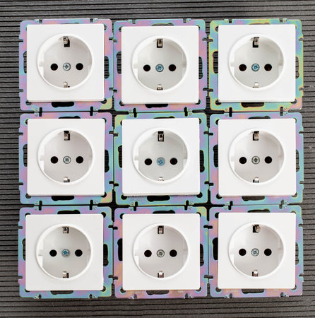 Background from home electric sockets, close-up. The concept of tariffs and prices for electricity. deviceの写真素材