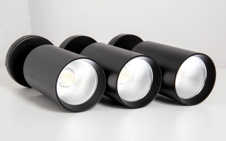 Black pendant lamps with matrix LED lighting on a white background, isolate. Light fixture for home...