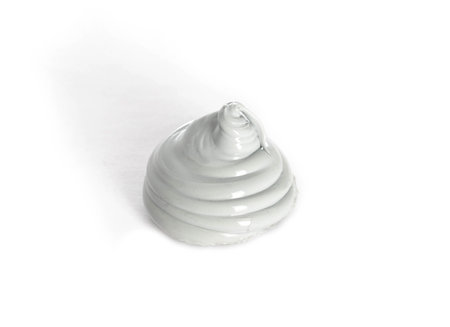 High quality automotive high temperature sealant. Gray universal one-component sealant, macro. White...