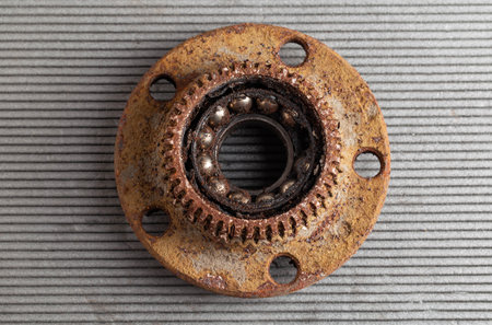 Old rusty wheel hub with a broken bearing. Bearing jamming. Automotive Partの写真素材