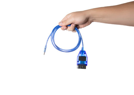 Blue car diagnostic cable in a man's hand on a white background, isolate. Close-up