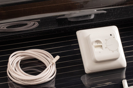 Set for mounting infrared floor heating. Temperature sensor and thermostat, infrared filmの写真素材