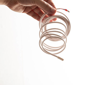 Temperature sensor for underfloor heating on a white background in a person's hand. Isolateの写真素材