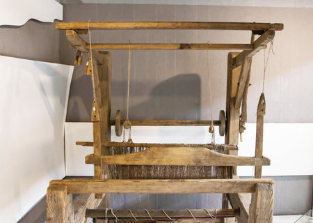 Old loom. Device for the manufacture of textile products, close-up, handmadeの写真素材