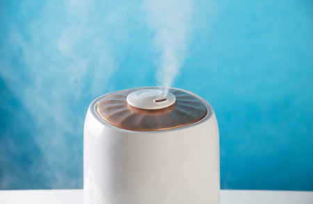 Modern air humidifier on a blue background. Humidification in the roomの写真素材
