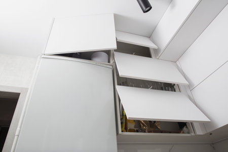 Organization of storage of utensils in the kitchen. Modern headset and planning for the manufacture of a section and drawers in the kitchen. Convenience of the location of dishes. Kitchen systemの写真素材