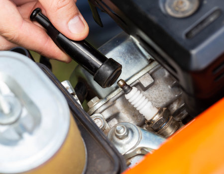 Replacing the spark plug in the motor block engine cylinder. Maintenance of the ignition system.