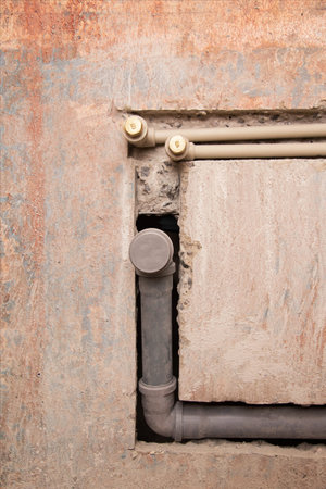 Supply of polypropylene water pipes in the wall and sewerage drain.