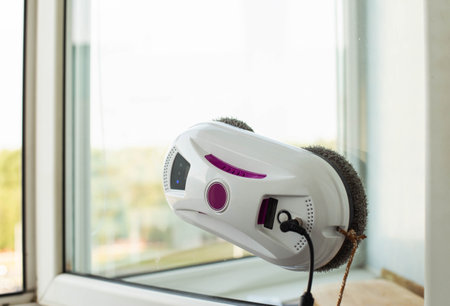 Clean windows safely with a window cleaning robot.の写真素材