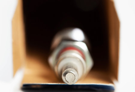 New modern ceramic glow plugs in packaging on a white background. Concept for replacing glow plugs in cold weather. Automotive partの写真素材