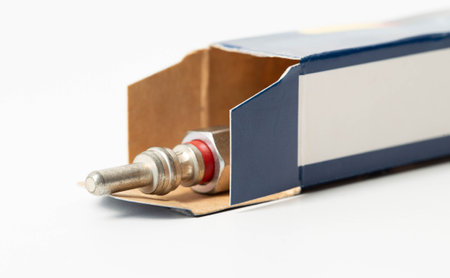 New modern ceramic glow plugs in packaging on a white background. Concept for replacing glow plugs...