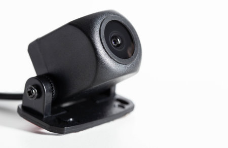 Modern car rear view camera on a white background, close-up, isolate.