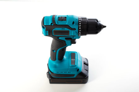 Modern cordless drill-driver on a white background, isolate. Modern screwdriver with quick-release chuck.の写真素材