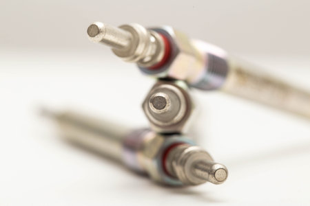 Modern ceramic glow plugs for warming up a diesel engine before starting. White background, isolate. Macro, engine startの写真素材