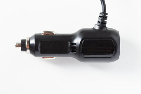 Electric adapter for charging into a car cigarette lighter on a white background, isolateの写真素材