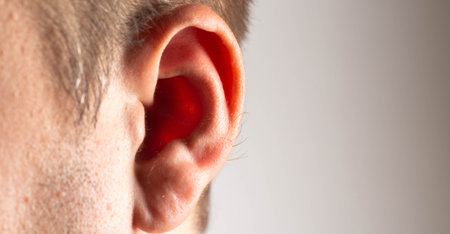 Growing hair on a man's ears, dermatology. Concept of laser hair removal on ears. Copy space for textの写真素材