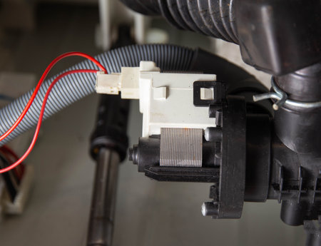 Damage and replacement of the washing machine drain pump.