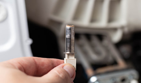 Removing the electric thermostat sensor from the washing machine. Repair of washing machinesの写真素材