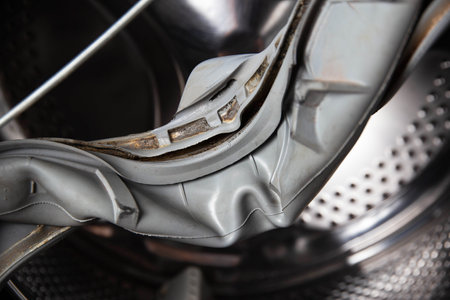 Old rubber hatch seal with washing machine defectの写真素材