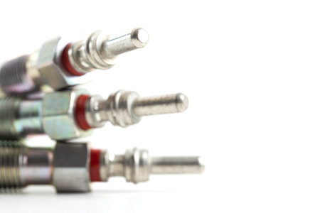Modern ceramic glow plugs for warming up a diesel engine before starting. White background, isolate. Macro, engine startの写真素材