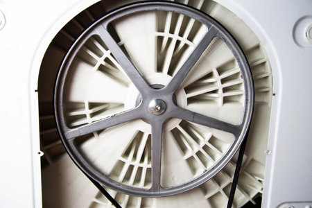 Washing machine pulley with belt. Breakage and replacement of belt with pulleys, industryの写真素材