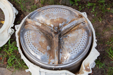 Broken crosspiece in the washing machine drum. Repair and replacement of the cross, industryの写真素材