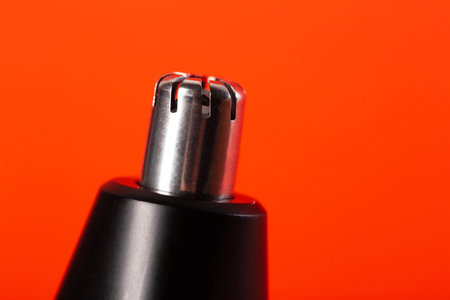 Modern trimmer attachment for removing nose hair, close-up.の写真素材