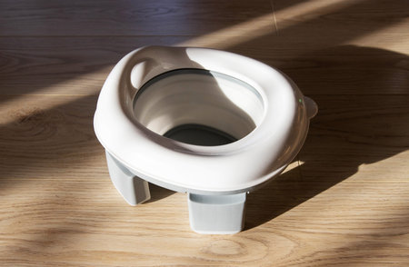 White children's folding travel potty. Mobile functional potty for the toilet.の写真素材