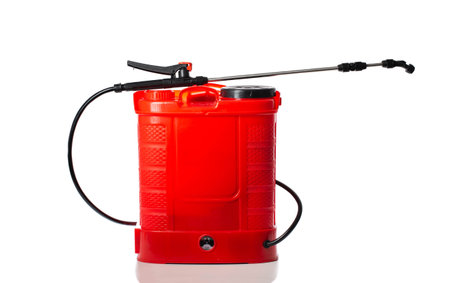 Modern red battery-powered sprayer with a retractable rod for spraying plants against pests, spreading fertilizers on a white background, isolate. Agricultureの写真素材