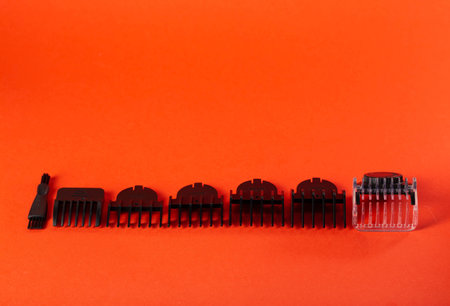 Set of edging attachments for trimmer on a red background. Copy space for textの写真素材