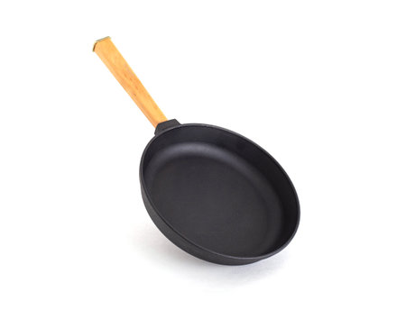 Round frying pan with wooden handle on white background, isolate, close-upの写真素材