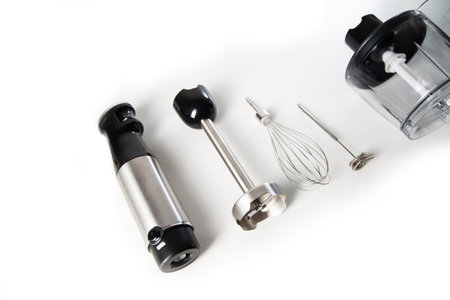 Modern set for immersion blender with whisk, milk frother and bowl on white background. Modern household appliances, close-upの写真素材