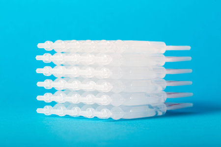 Tubes with medicine on a blue background. Concept of a laxative for the treatment of constipation in the intestines. Restoration of intestinal microfloraの写真素材