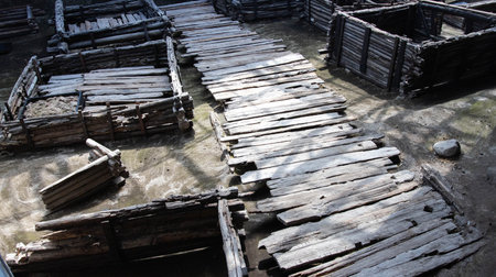 Ancient historical excavations in a museum with wooden village houses. Historical excavationsの写真素材