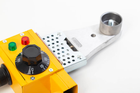 Electric soldering iron for welding polypropylene pipes on a white background, isolate. Plumbing deviceの写真素材