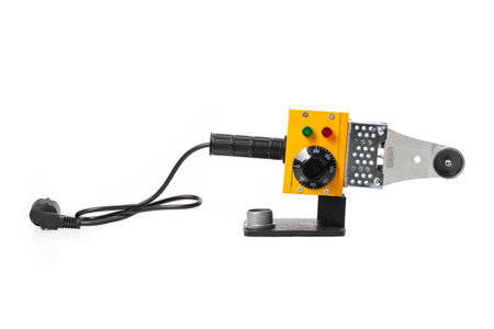Electric soldering iron for welding polypropylene pipes on a white background, isolate. Plumbing deviceの写真素材