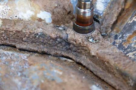 Broken crosspiece in the washing machine drum. Repair and replacement of the cross, industryの写真素材