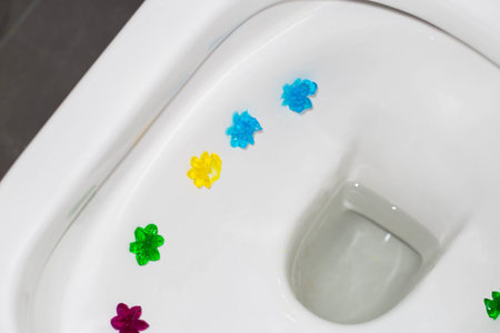 Multi-colored flowers in the toilet with different smells. Antibacterial and cleansing effectの写真素材