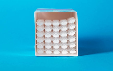 Tubes with medicine on a blue background. Concept of a laxative for the treatment of constipation in the intestines. Restoration of intestinal microfloraの写真素材