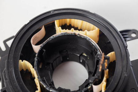 disassembled broken steering column electrical cable on white background, isolateの写真素材