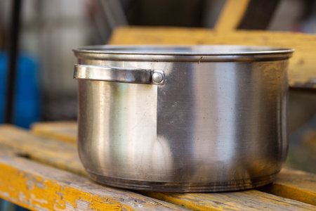 A broken metal pan with a crack