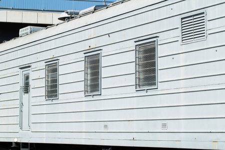 Windows behind bars in a special carriage for transporting prisoners, industry. Copy space for text,...