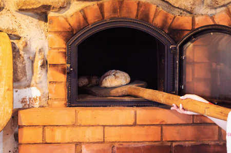 Baking rye bread in a rustic oven