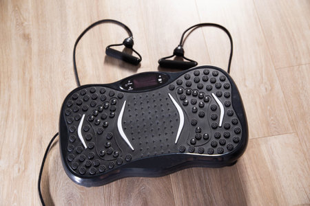 Modern exercise machine for sports and weight loss. Vibration platform for home.