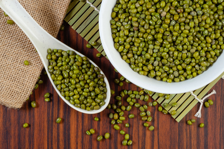 Mung beans on wooden tableの写真素材